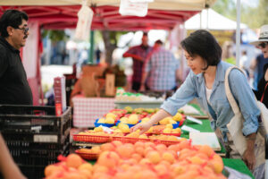 Xaioyun Pan Shopping at the farmers market in San Diego