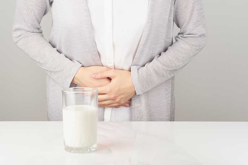 woman struggling with digestive issues
