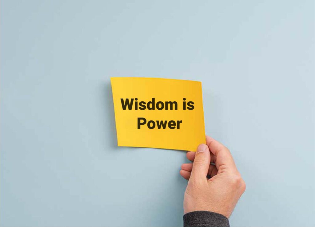 yellow post it note with wisdom is power written on it